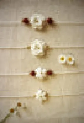 Handmade Crochet Rakhi with Rudraksh - White double flower
